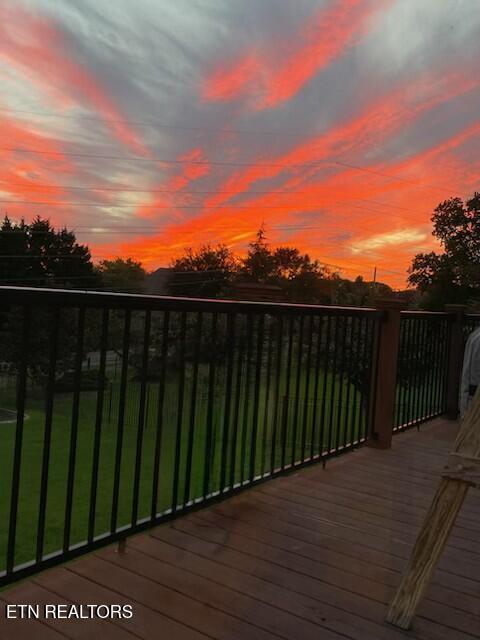 deck at dusk with a yard