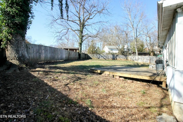 view of yard with a wooden deck