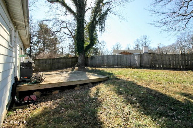 view of yard with a wooden deck