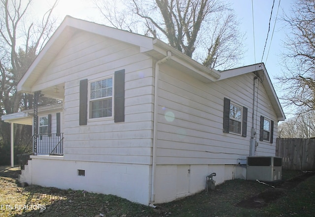 view of side of home with cooling unit