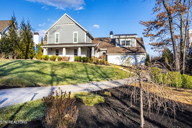 view of front of home featuring covered porch and a front yard