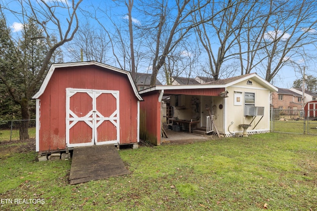 view of outdoor structure featuring cooling unit and a yard