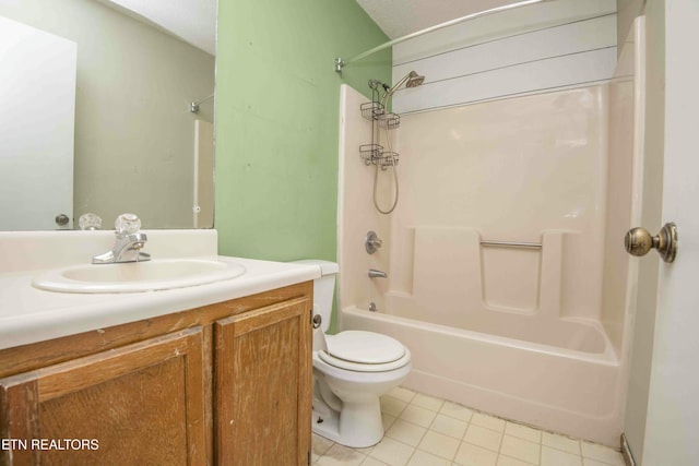 full bathroom featuring bathtub / shower combination, vanity, toilet, tile patterned floors, and a textured ceiling