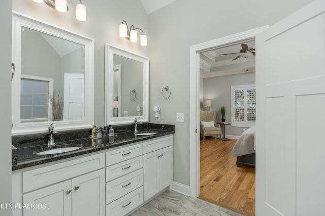 bathroom with ceiling fan, hardwood / wood-style flooring, vanity, and crown molding