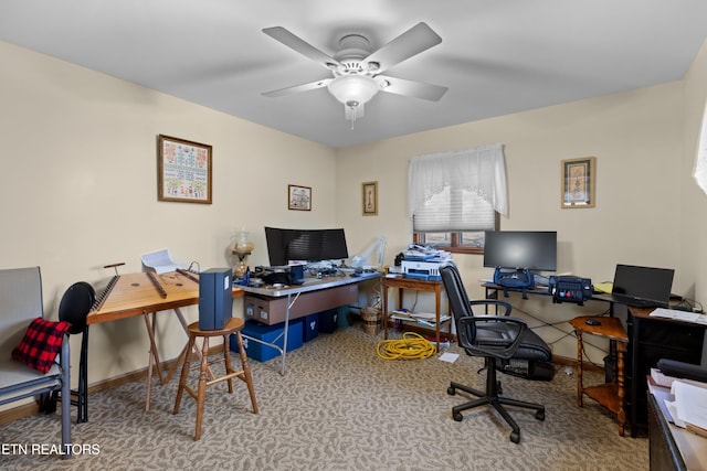 office area featuring ceiling fan and carpet flooring