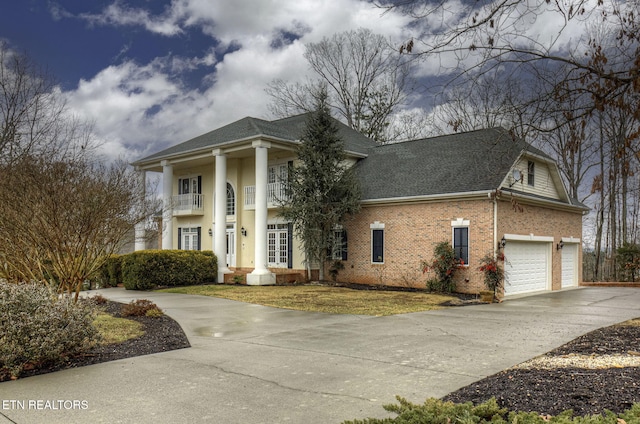 greek revival house with a garage