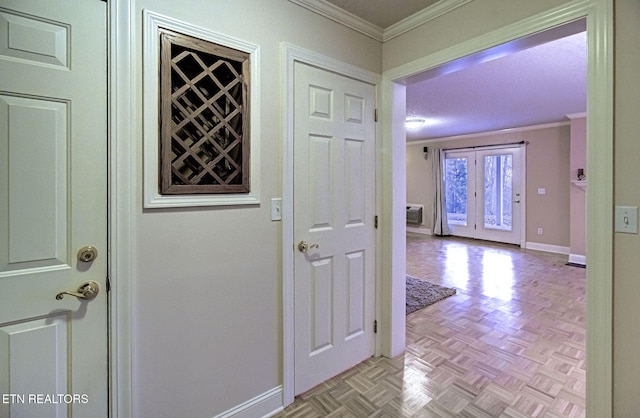 interior space featuring light parquet floors, ornamental molding, and bar area