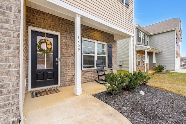 entrance to property with a porch