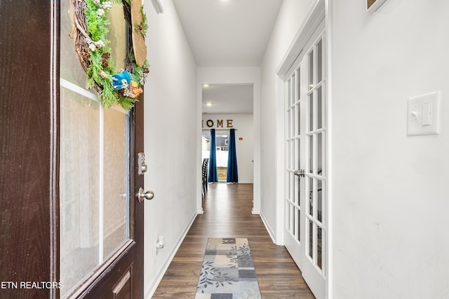 hall with french doors and dark hardwood / wood-style flooring