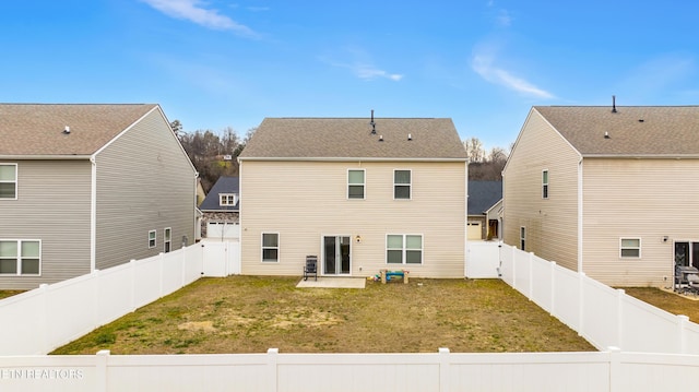 rear view of property with a patio area and a yard