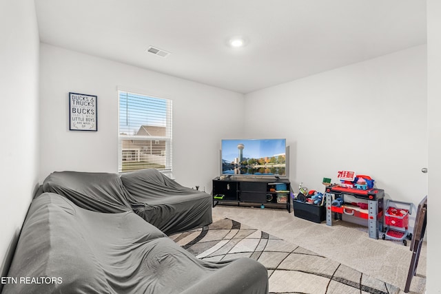 living room featuring light carpet