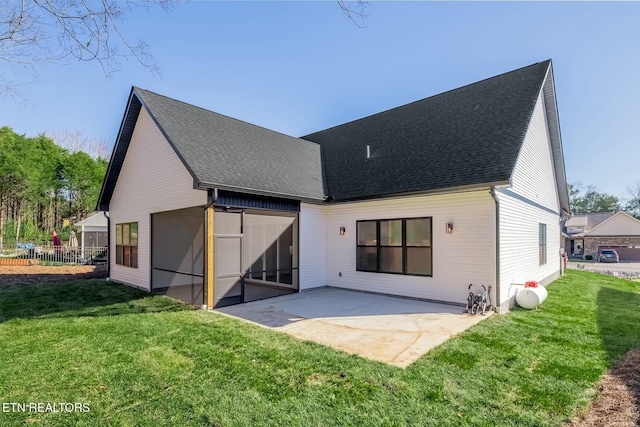 back of property featuring a lawn and a patio