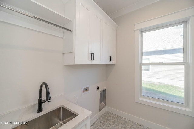 laundry room featuring sink, electric dryer hookup, cabinets, and hookup for a washing machine