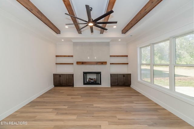 unfurnished living room with light wood-type flooring, beam ceiling, and ceiling fan