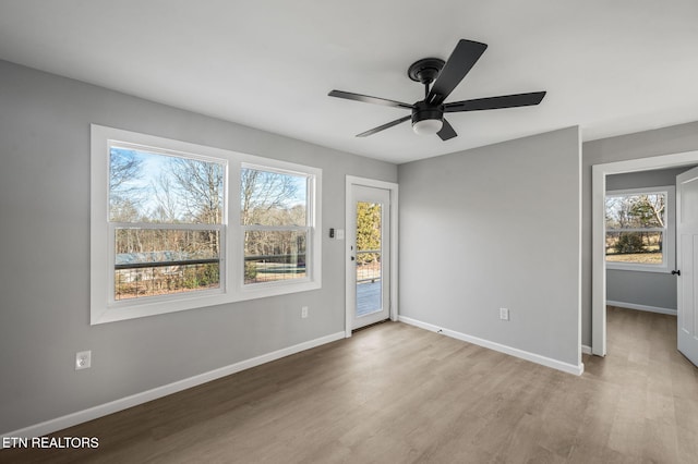 spare room featuring ceiling fan and light hardwood / wood-style floors