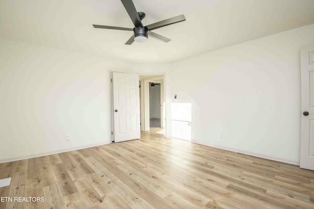 spare room featuring ceiling fan and light wood-type flooring