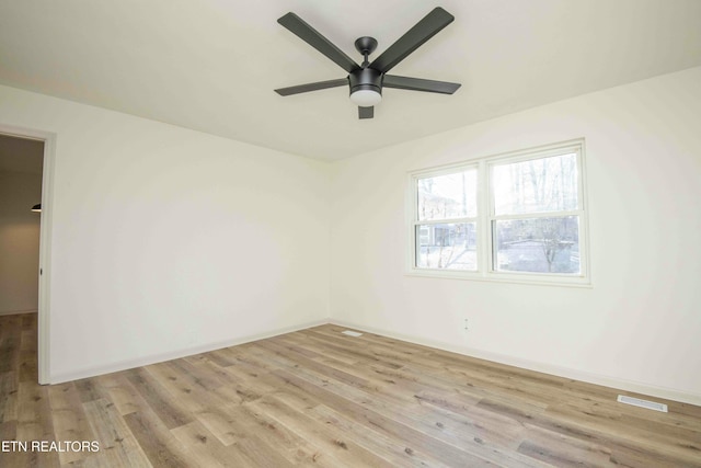 unfurnished room featuring ceiling fan and light wood-type flooring