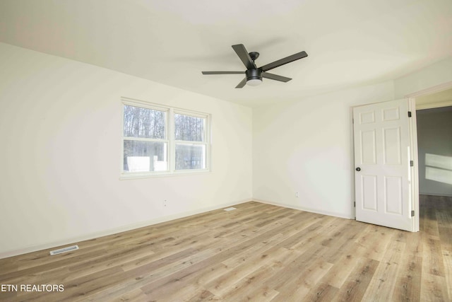 unfurnished room with ceiling fan and light wood-type flooring