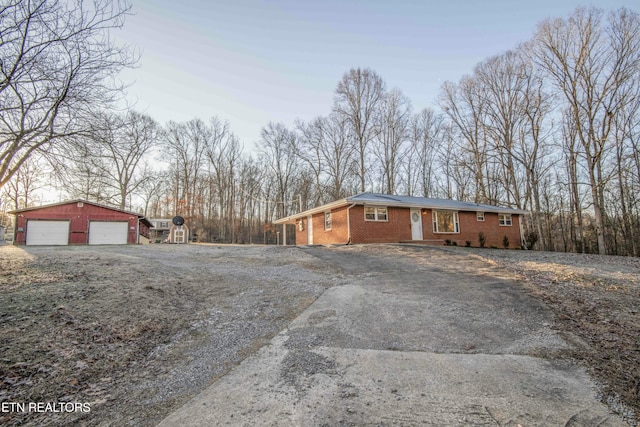 view of property exterior featuring an outbuilding and a garage