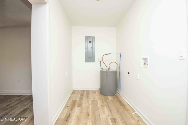 laundry area featuring electric panel, washer hookup, gas water heater, hookup for an electric dryer, and light wood-type flooring