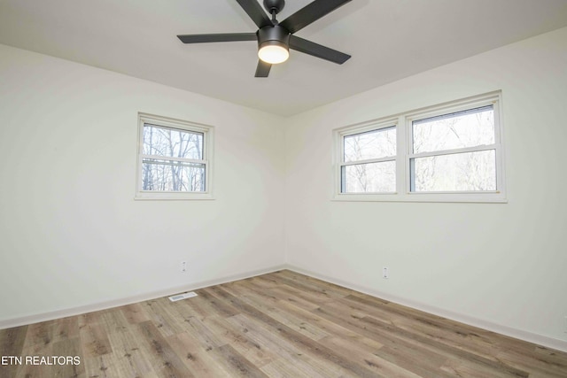 spare room featuring light hardwood / wood-style flooring