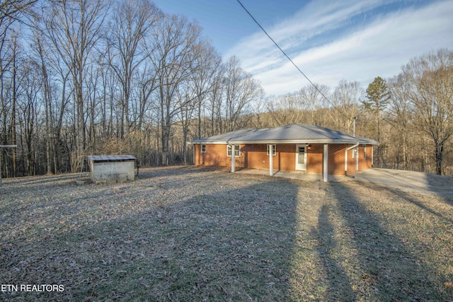 view of front of property with a storage unit