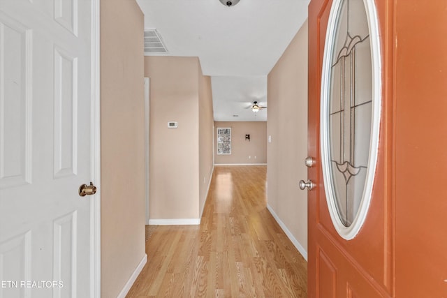 hall with light hardwood / wood-style flooring