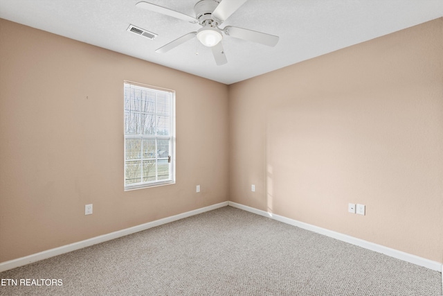 carpeted empty room with ceiling fan