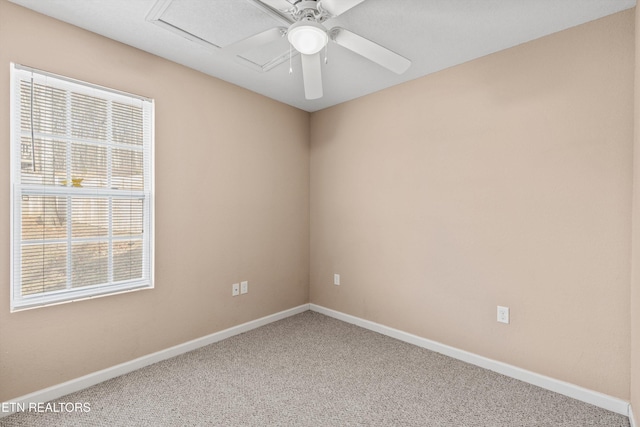 empty room with ceiling fan and carpet floors