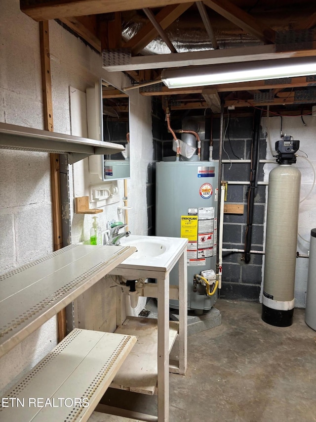 utility room with sink and gas water heater