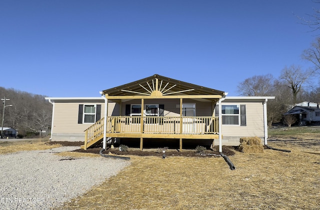 view of front of home featuring a wooden deck