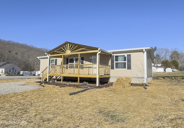 view of front of property with a deck