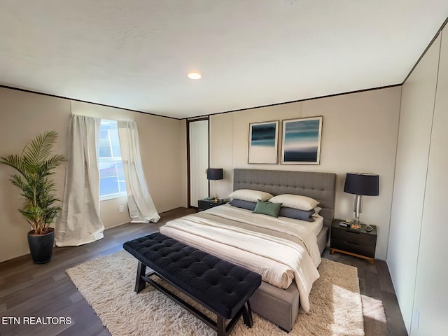 bedroom with wood finished floors