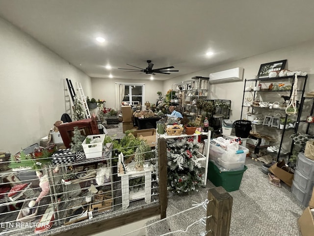 misc room with a wall mounted air conditioner, ceiling fan, and carpet