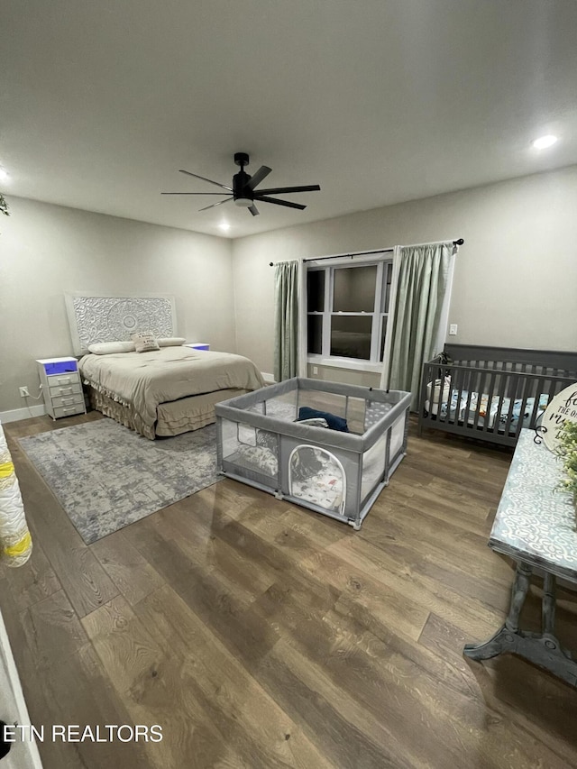 bedroom with ceiling fan and hardwood / wood-style floors