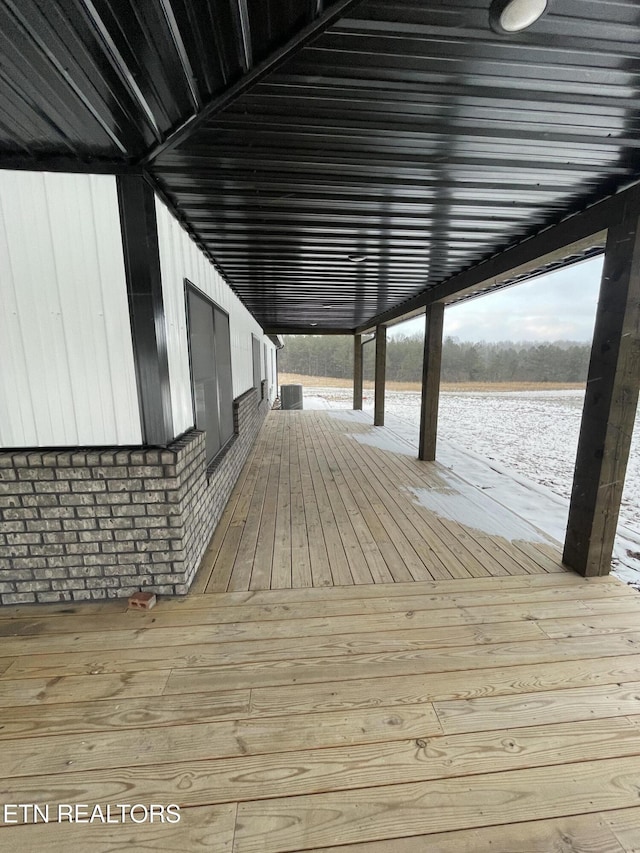 view of dock with cooling unit and a water view