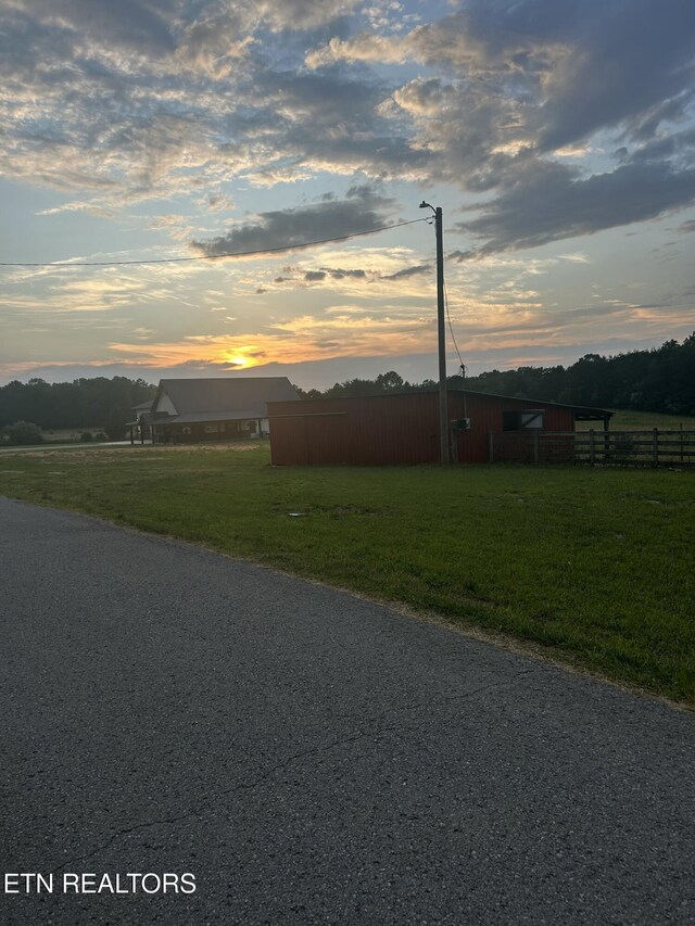 136 Falling Leaf Rd, Jamestown, TN 38556 - view of asphalt road with street lights and an outbuilding