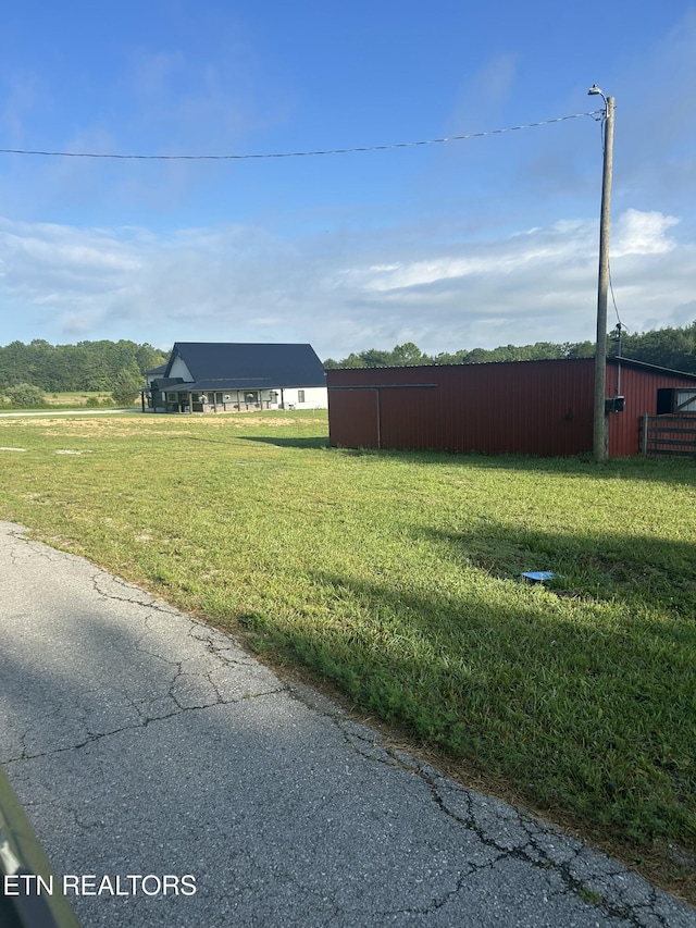 136 Falling Leaf Rd, Jamestown, TN 38556 - view of grassy yard with an outbuilding