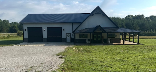 136 Falling Leaf Rd, Jamestown, TN 38556 - modern farmhouse with gravel driveway, a front lawn, a garage, and a metal roof