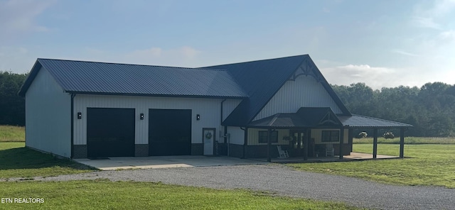 136 Falling Leaf Rd, Jamestown, TN 38556 - modern farmhouse with a front lawn, driveway, a porch, and a metal roof