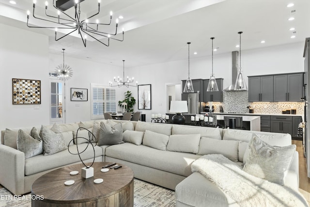 living room with a notable chandelier