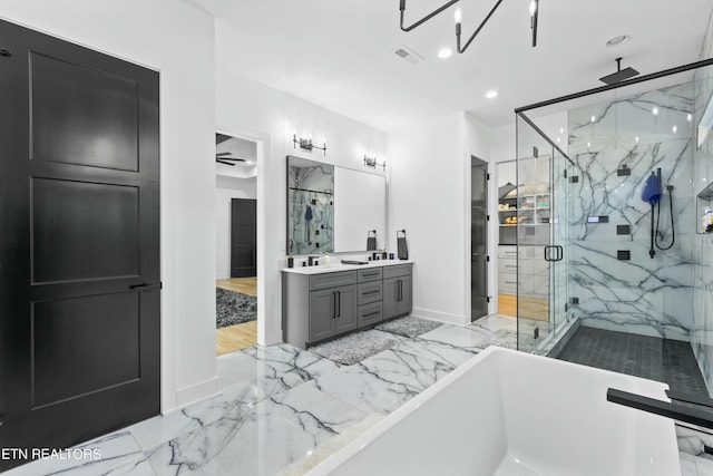 bathroom with vanity, ceiling fan, and shower with separate bathtub