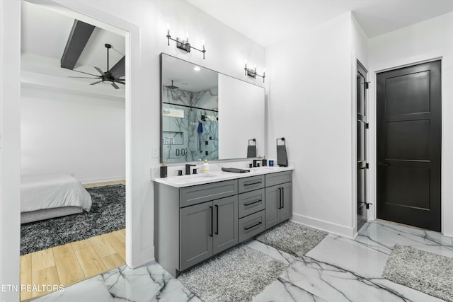 bathroom featuring vanity, a shower with shower door, and ceiling fan