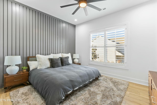 bedroom featuring ceiling fan and light hardwood / wood-style flooring