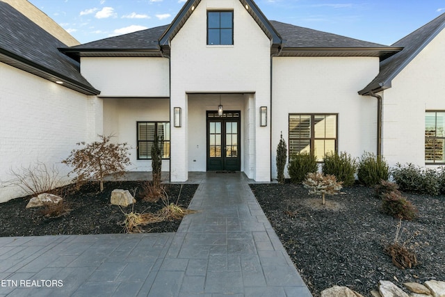 entrance to property featuring french doors