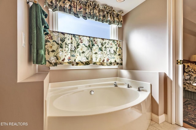 full bath with a garden tub and tile patterned floors