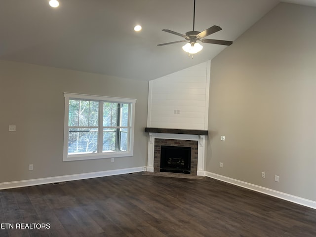 unfurnished living room featuring ceiling fan, high vaulted ceiling, dark wood-type flooring, and a fireplace