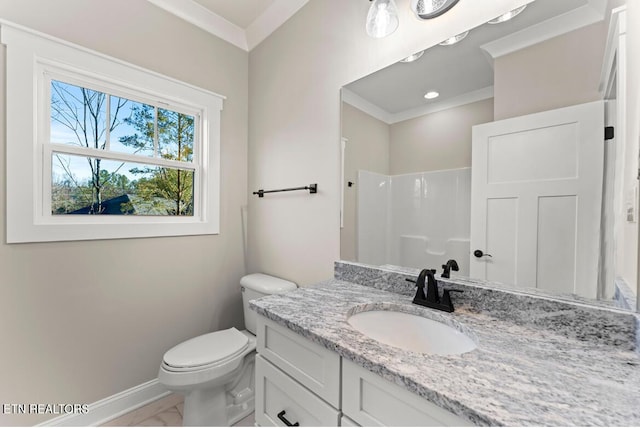 bathroom with toilet, vanity, ornamental molding, and walk in shower