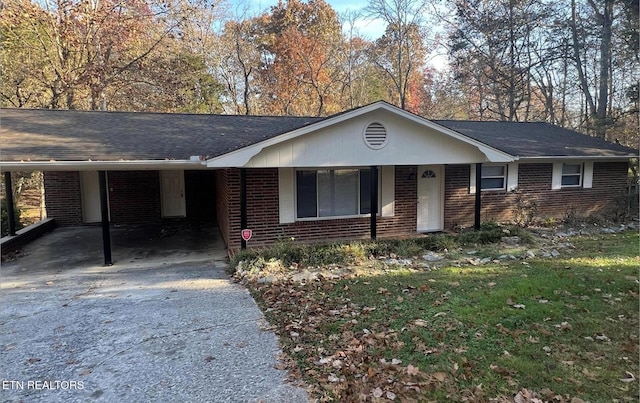 single story home featuring a carport