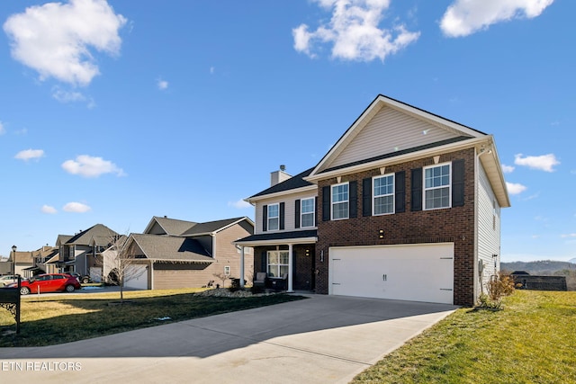 view of front property with a garage and a front yard